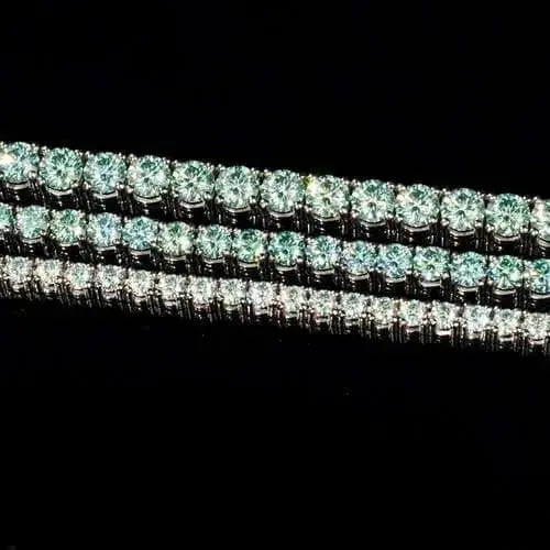 Elegant tennis chain adorned with exquisite blue green gemstones, a perfect luxury accessory for refined style.