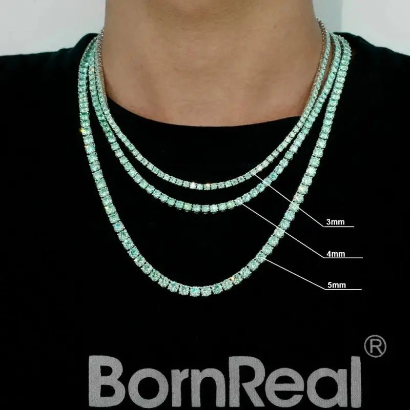 Elegant tennis chain adorned with exquisite blue green gemstones, a perfect luxury accessory for refined style.