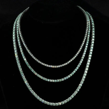 Elegant tennis chain adorned with exquisite blue green gemstones, a perfect luxury accessory for refined style.