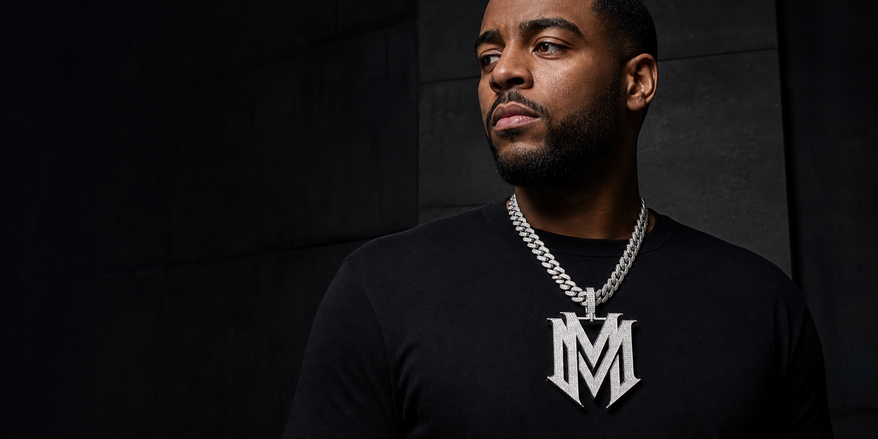 BornReal custom double-M iced pendant worn on a model